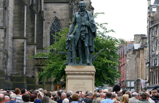 Crowds gather around a newly unveiled statue of the famous Scottish economist Adam Smith in Edinburgh